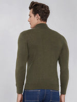 A man wears a 98degreenorth Men’s Olive Merino Wool Turtle Neck Sweater against a plain light background.