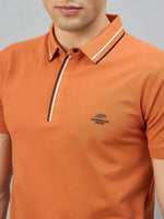 Man wears 98degreenorth Orange Polo—Handmade Series, contrast tipping, suits Indian skin tones.