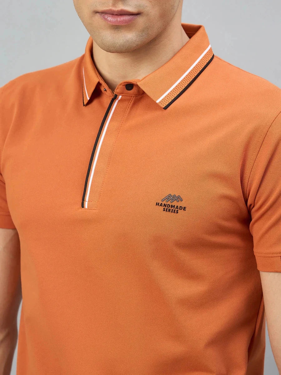 Man wears 98degreenorth Orange Polo—Handmade Series, contrast tipping, suits Indian skin tones.