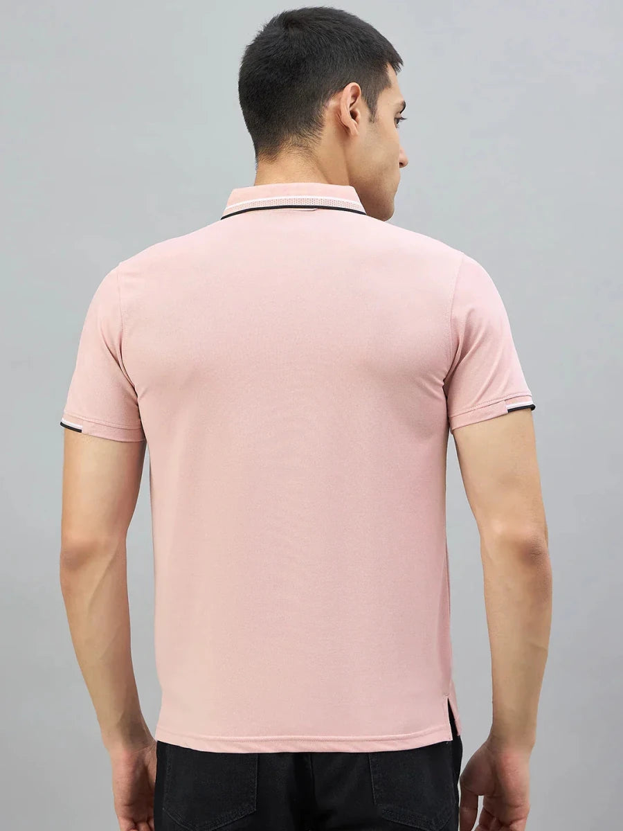 Man wears a 98degreenorth Handmade Pink Polo with contrast tipping, shown from the back on a grey background.