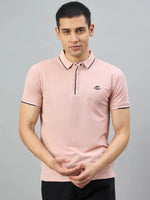 Man wearing a 98degreenorth Men's Pink Polo T-Shirt — Handmade Series with contrast tipping, on a plain gray background.