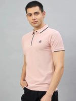 Man wearing 98degreenorth Men's Pink Polo T-Shirt — Handmade Series with contrast tipping, styled with black pants.