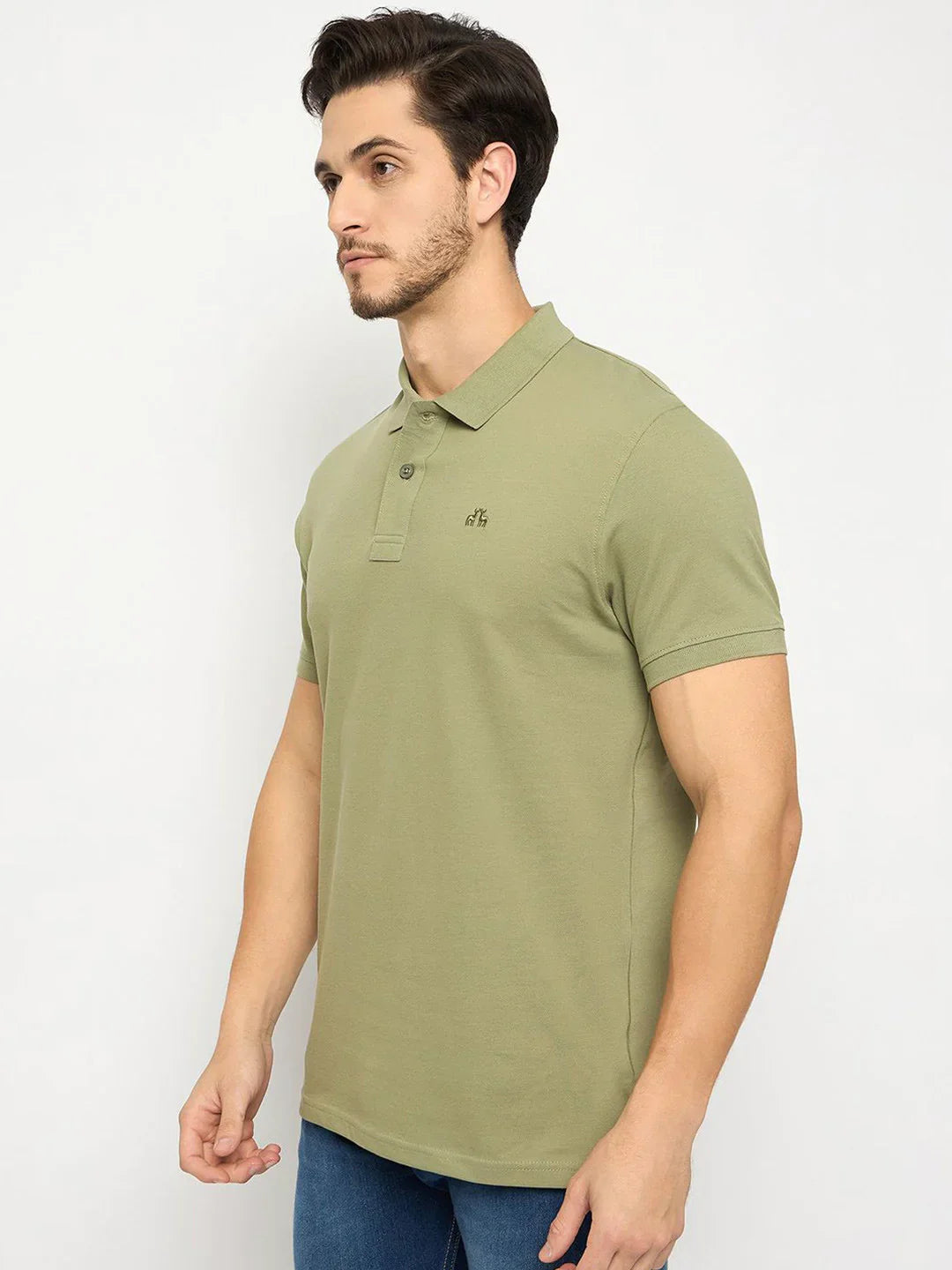 A man in a 98degreenorth Men's Pista Green Polo T-Shirt stands against a plain white background.