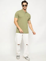 Man in 98degreenorth Men's Pista Green Polo T-Shirt—Pure Cotton Pique with Chest Pocket, styled simply on white backdrop.
