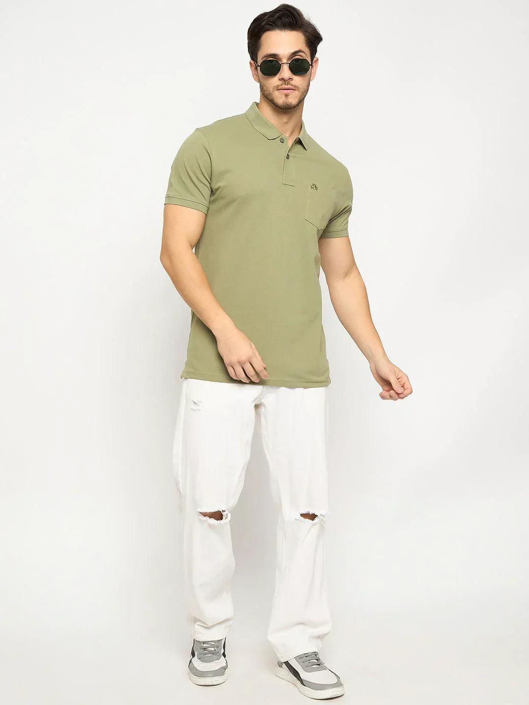 Man in 98degreenorth Men's Pista Green Polo T-Shirt—Pure Cotton Pique with Chest Pocket, styled simply on white backdrop.