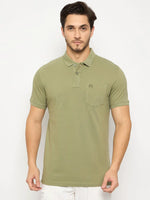 Man in 98degreenorth Men's Pista Green Polo—pure cotton pique with chest pocket—against a white background.