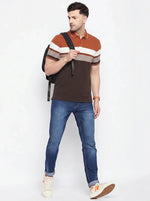 Man in a 98degreenorth rust brown striped polo t-shirt, blue jeans, white sneakers, and a backpack on white background.