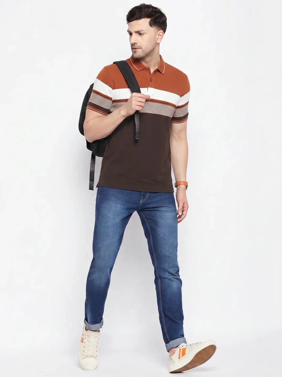 Man in a 98degreenorth rust brown striped polo t-shirt, blue jeans, white sneakers, and a backpack on white background.