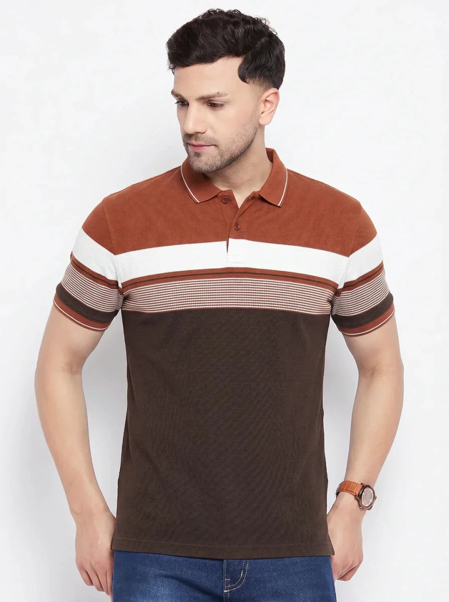 Man wears 98degreenorth Men's Rust Brown Striped Polo T-Shirt, colour block pique knit, with blue jeans.