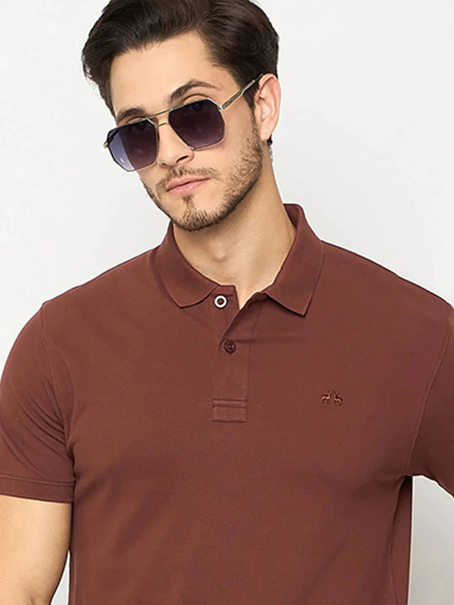 Man in 98degreenorth Men's Rust Solid Polo T-Shirt—Cotton Pique, posing against a light background.