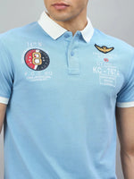 Man in a Men's Sky Blue Aeronorth KC-767A Aviation Polo by 98degreenorth—ideal for aviation fans.