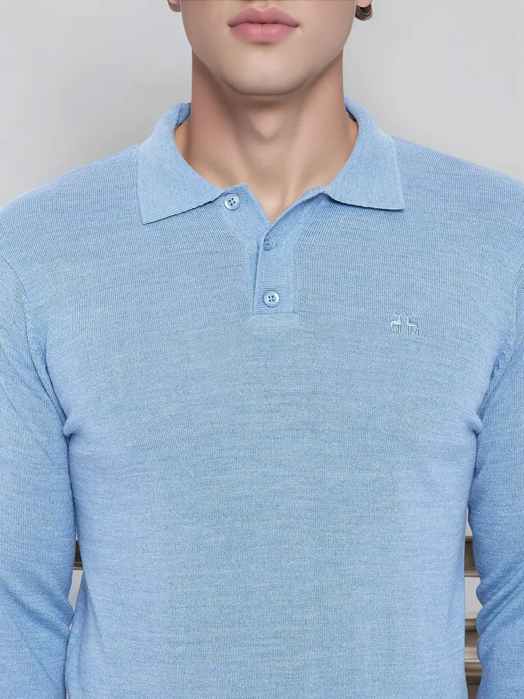 Model wearing a 98degreenorth Men’s Sky Blue Merino Wool Polo Sweater, shown from shoulders to chest.