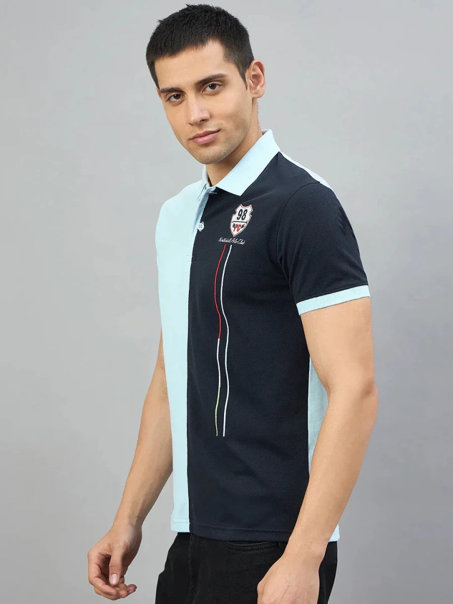 Man wears Men's Sky Blue & Navy Colour Block Polo T-Shirt by Northhills Polo Club, 98degreenorth.