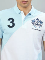 Man in 98degreenorth Men’s Sky Blue & White Colour Block Polo with Marine Harbns embroidery and a “3” crest.