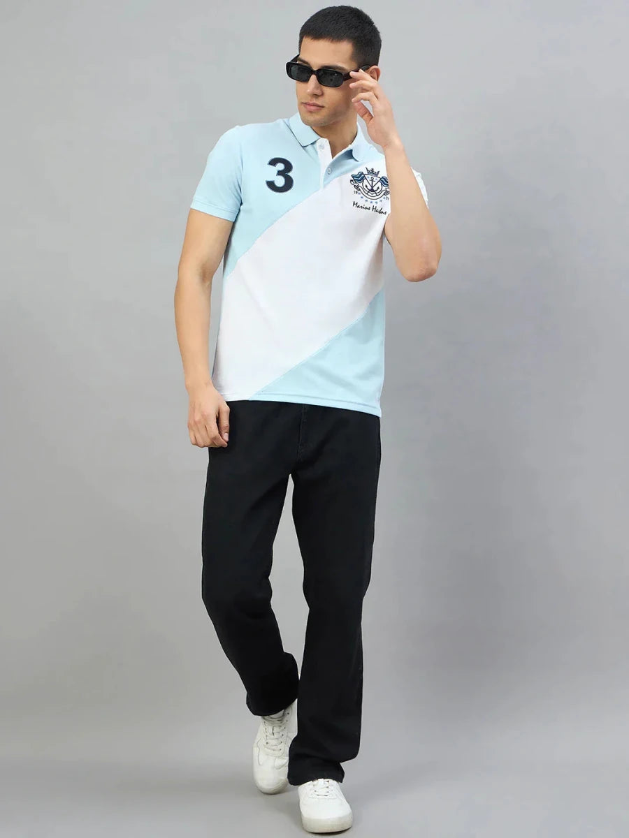 Man in a 98degreenorth Sky Blue & White Colour Block Polo T-Shirt poses against a plain background.