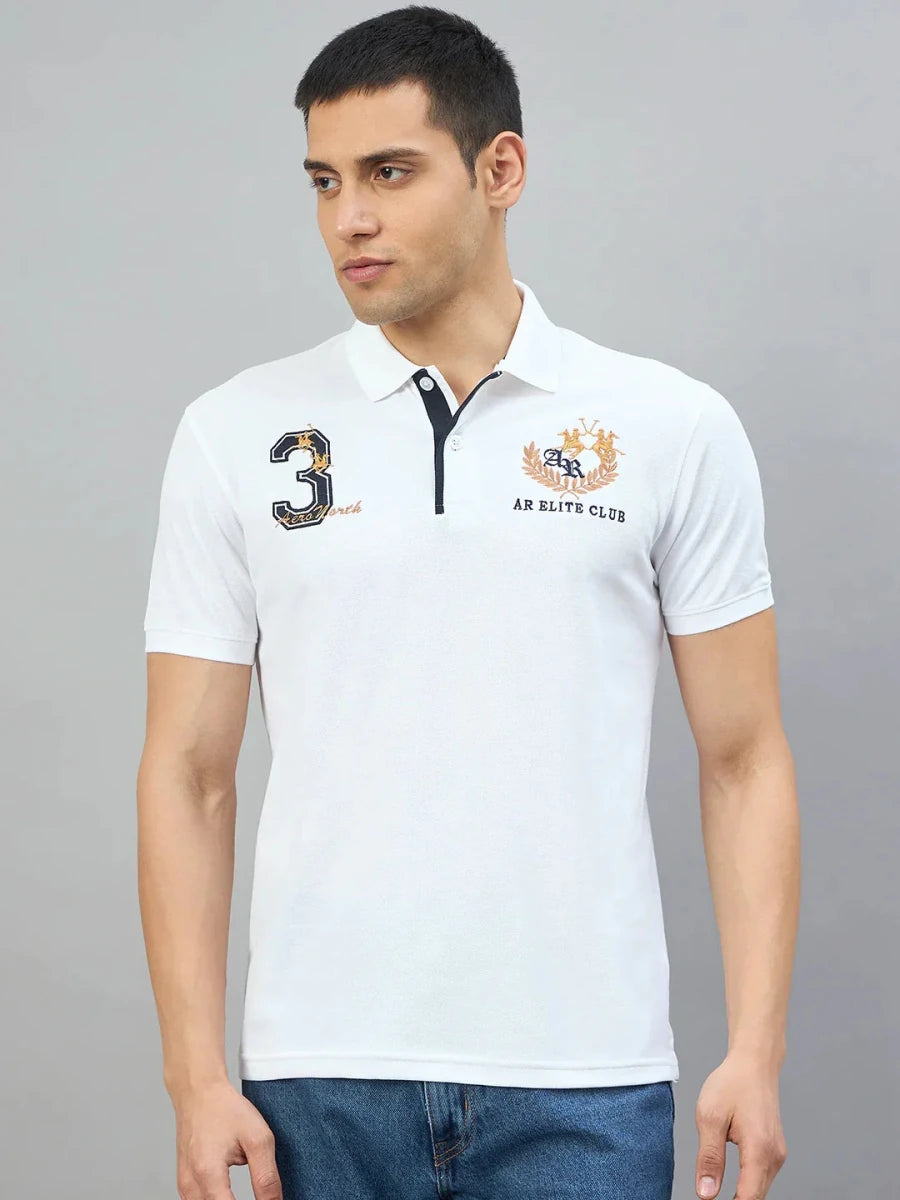Man wearing the Men's White AR Elite Club No.3 Polo T-Shirt by 98degreenorth against a plain gray background.