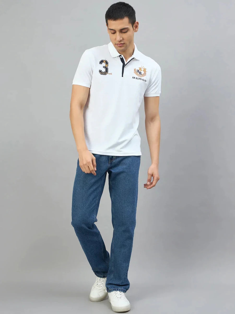 Man wearing 98degreenorth Men's White AR Elite Club No.3 Polo T-Shirt, paired with blue jeans and white shoes.