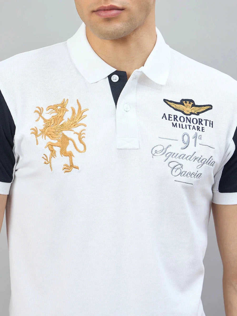 Man in 98degreenorth Men's White Black Sleeve Aeronorth 91ª Polo T-Shirt with gold griffin logo embroidery.