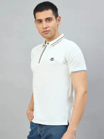 Man wears 98degreenorth Men's White Polo T-Shirt—Handmade Series with contrast tipping, against a grey background.