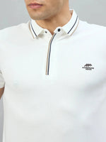 Man wears 98degreenorth Handmade Series White Polo with contrast tipping and logo from 98 Degree North.
