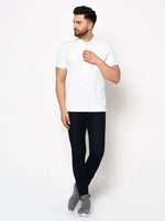 Man in a 98degreenorth Men's White Polo T-Shirt—stretch cotton pique with chest pocket, wardrobe essential.