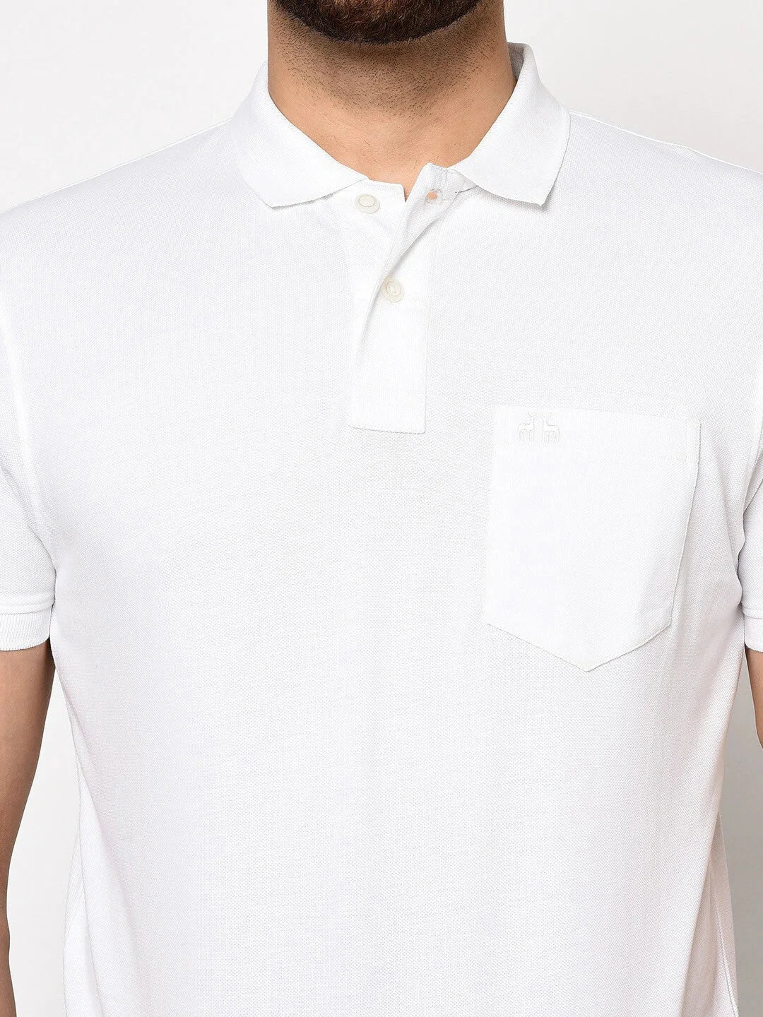 Man in 98degreenorth Men's White Polo T-Shirt—Stretch Cotton Pique with chest pocket, shown waist up.