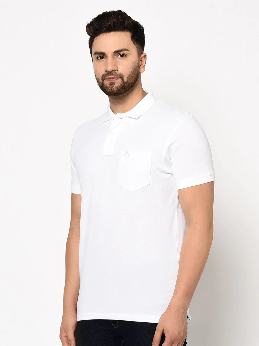 Man wears 98degreenorth Men's White Polo T-Shirt in stretch cotton pique with chest pocket, against white background.