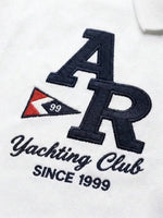 Men's White Yachting Club Polo by 98degreenorth with yacht, AR letters, and red/black 99 pennant embroidery.