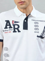 Man wears 98degreenorth Men's White Yachting Club Polo T-Shirt with nautical embroidery and club text.