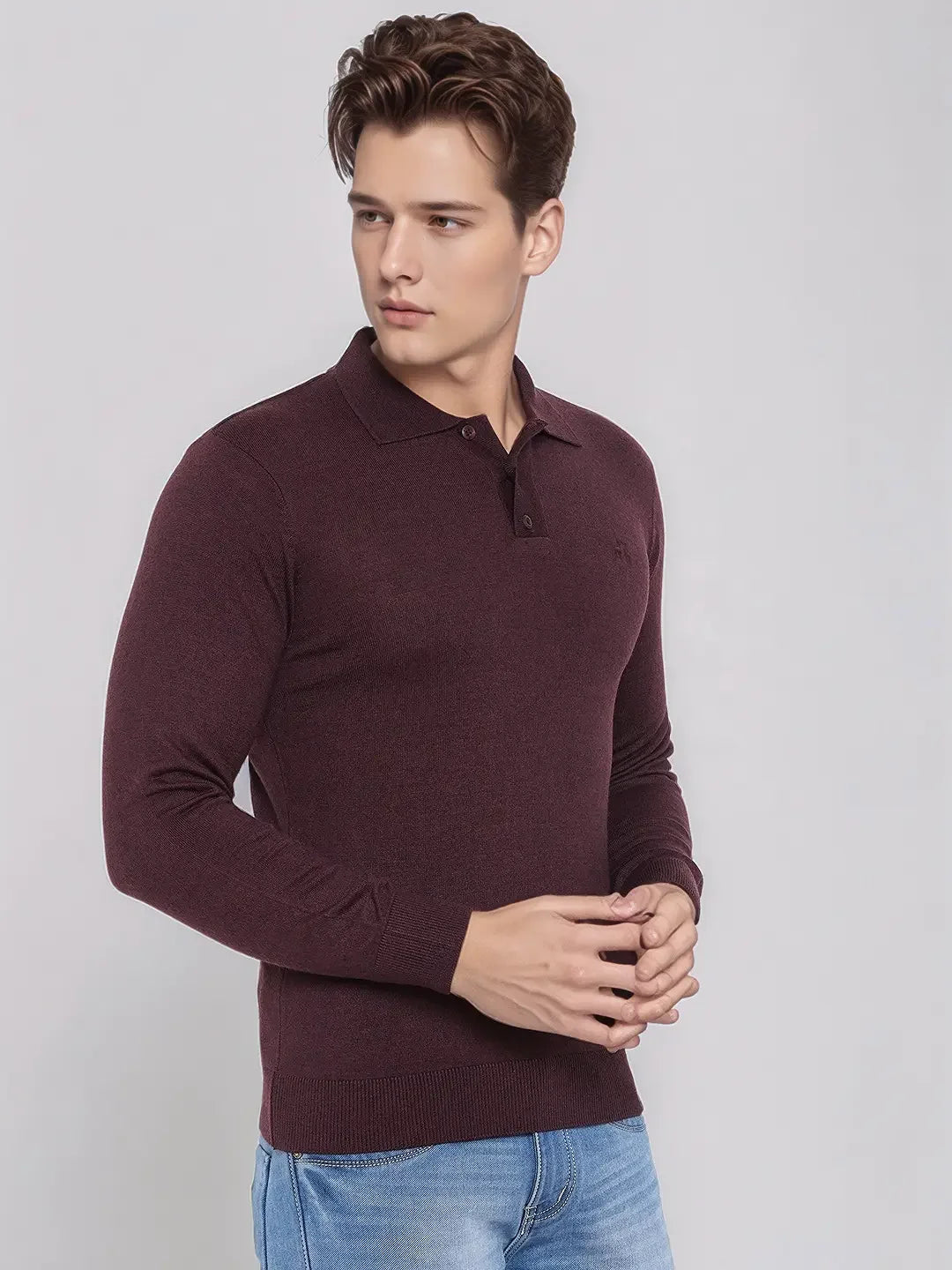 A man wears the 98degreenorth Men’s Wine Merino Wool Polo Neck Sweater against a plain light background.