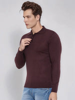 Man wears 98degreenorth Men’s Wine Merino Wool Polo Neck Sweater with blue jeans against a plain light background.