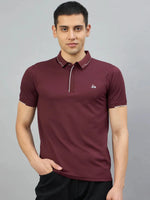 Man models 98degreenorth Men's Wine Polo T-Shirt with white tipping & LA logo, hand in pocket, gray background.