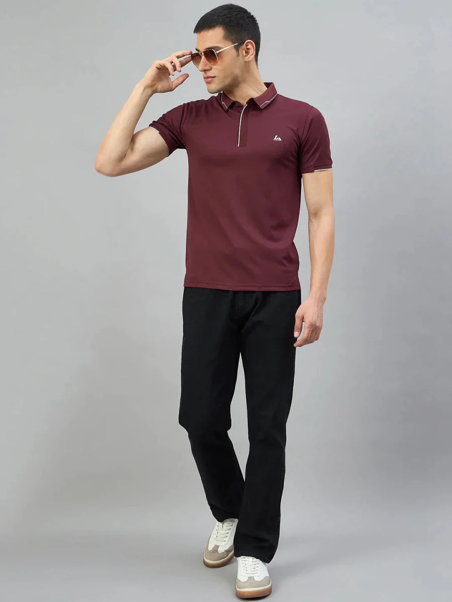 Man in 98degreenorth Men's Wine Polo T-Shirt with White Tipping, black pants, and white sneakers against gray background.