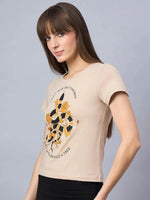 Woman with straight brown hair wears a 98degreenorth cotton tee with minimal typography print, against a gray background.