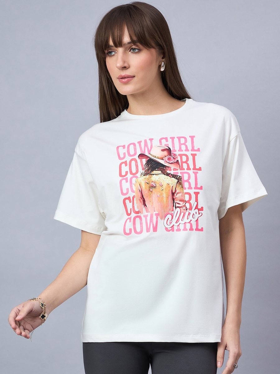 A woman wears the 98degreenorth Offwhite Typography Graphic Cotton Tee—streetwear drop shoulder style.