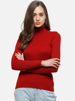 Woman with long brown hair in a 98degreenorth red ribbed stretch turtleneck sweater and light blue jeans, arms crossed.