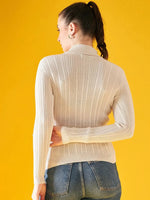 A woman with a ponytail stands with her back to the camera against a bright yellow background, wearing blue jeans and the 98degreenorth Ribbed Offwhite Turtle Neck Pullover.