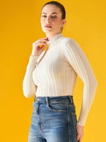 A woman in a 98degreenorth Ribbed Offwhite Turtle Neck Pullover and high-waisted blue jeans stands against a solid yellow background, looking confidently at the camera.