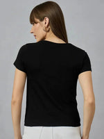 Woman with straight brown hair wears a 98degreenorth round-neck typography cotton t-shirt, facing away from the camera.