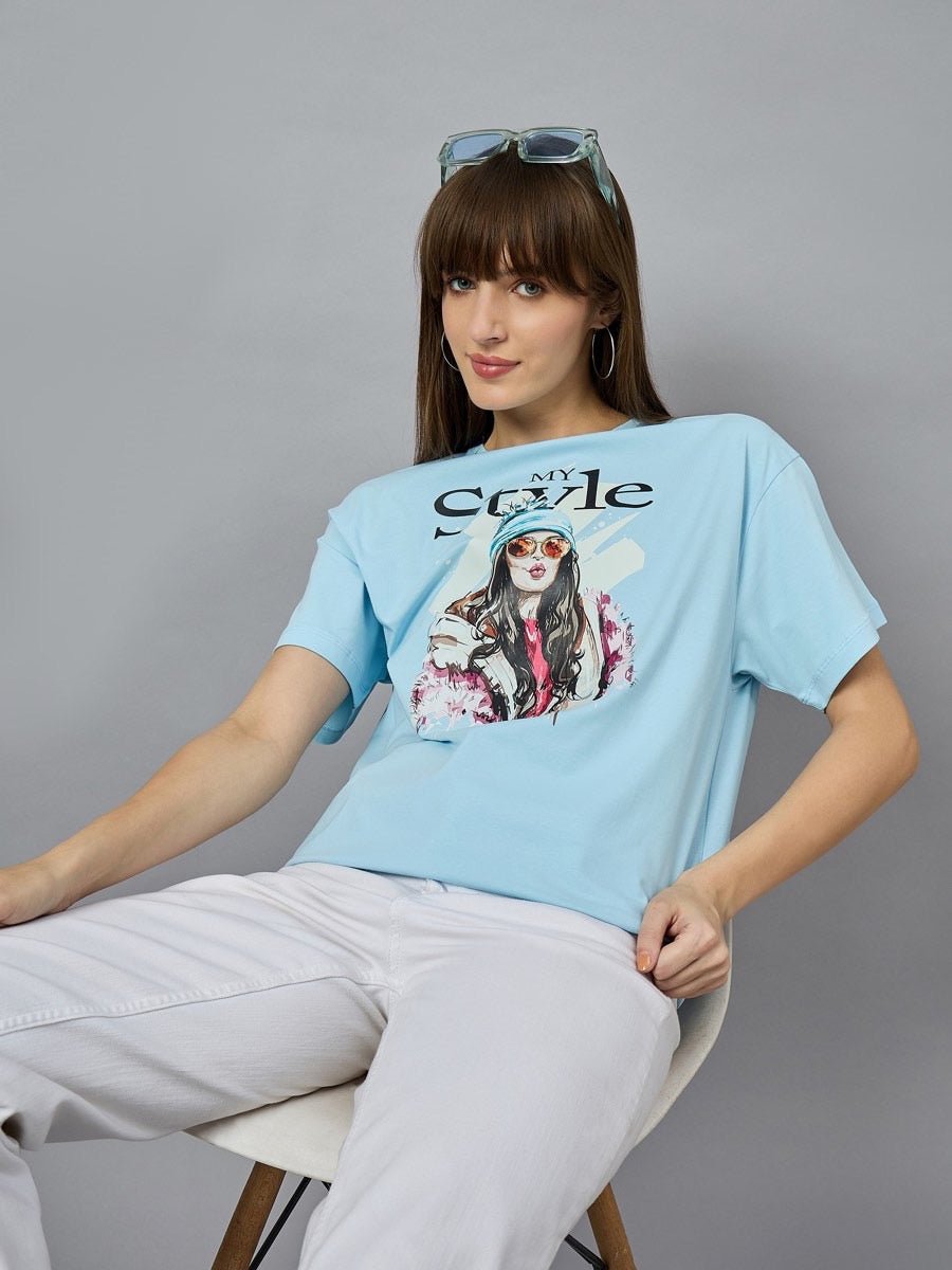 Model wears 98degreenorth Soft Cotton Typography Printed Tee, drop shoulder sleeves, urban style, with white pants.