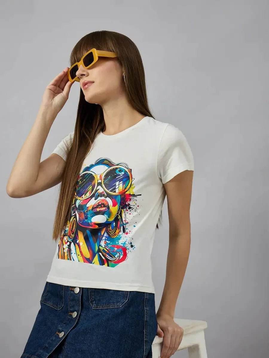 Woman in yellow sunglasses and denim skirt wears a 98degreenorth typography cotton tee for standout streetwear style.