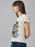 Woman in a 98degreenorth stylish typography cotton tee, highlighting casual womens streetwear on a gray background.