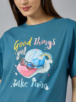 Woman in a 98degreenorth Trendy Typography Graphic T-shirt—cotton, round neck, drop shoulder, Good things take time.
