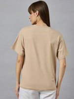 Woman with long brown hair wears 98degreenorths Trendy Typography Oversized Cotton T-shirt, shown from the back.