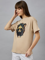 Woman in a 98degreenorth Trendy Typography Printed Oversized Cotton T-shirt, styled for chic streetwear.