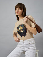 Woman in a 98degreenorth trendy typography printed oversized cotton t-shirt—perfect for streetwear style.
