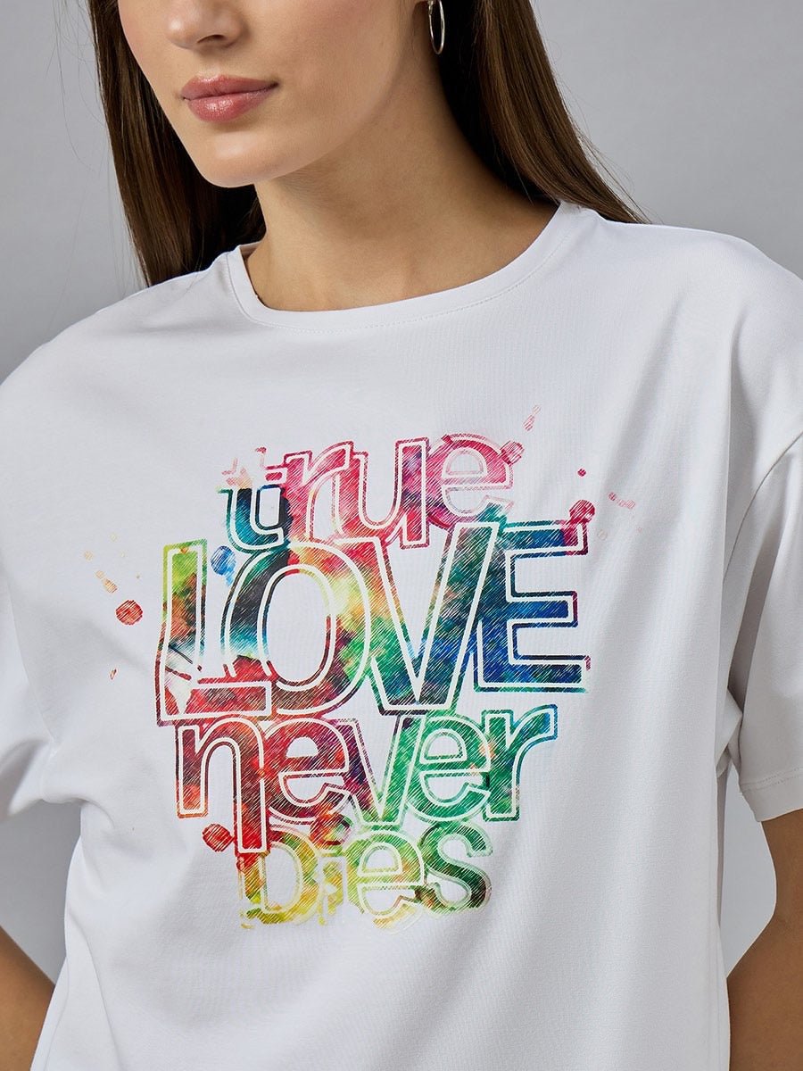 Woman wearing a 98degreenorth Typography Graphic T-shirt – Relax Fit Cotton Round Neck with “true LOVE never dies” front.
