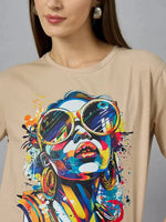 A woman in a 98degreenorth Typography Print Women’s Cotton T-shirt—relaxed, casual wear with a bold graphic.
