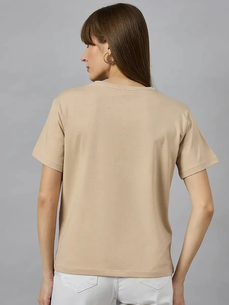 Woman with straight brown hair wears a 98degreenorth Typography Print Women’s Cotton T-shirt, facing away from the camera.