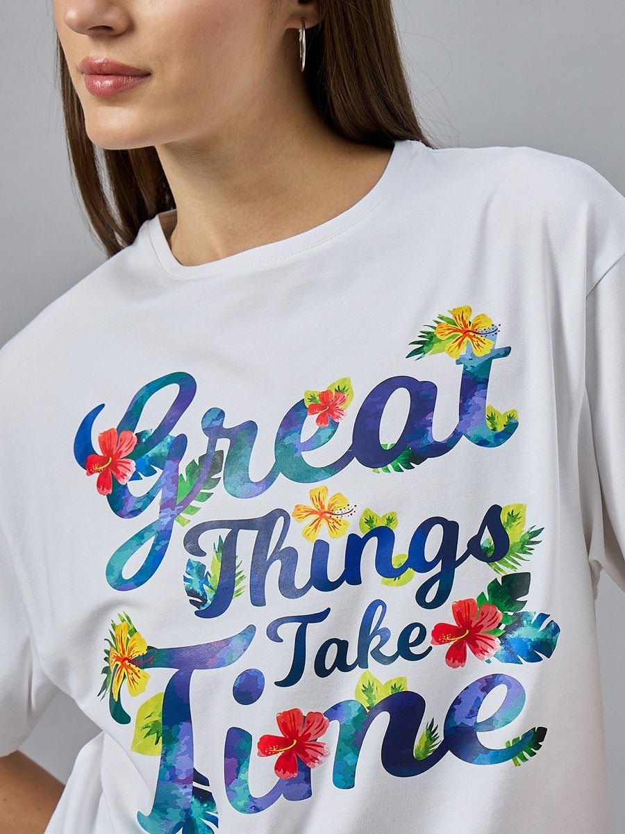 Woman wearing 98degreenorth’s Urban Streetwear Typography T-shirt with “Great Things Take Time” text on the front.